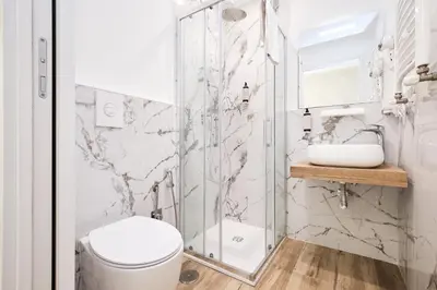 a bathroom with a shower and a toilet and a sink at 5 minutes from the Vatican - Elegant flat - Wi-Fi in Rome