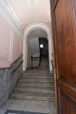 an empty hallway with stairs in an old building at BnB Rooms And Comfort in Rome