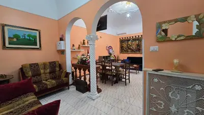 a living room with a couch and a table at BnB Rooms And Comfort in Rome