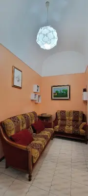a living room with two couches in a room at BnB Rooms And Comfort in Rome