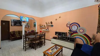 a living room with a kitchen and a dining room at BnB Rooms And Comfort in Rome