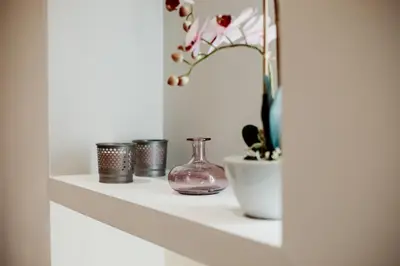 a shelf with a vase and other items on it at Vatican Charming RHome in Rome