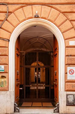 an entrance to a building with a large wooden door at Vatican Charming RHome in Rome