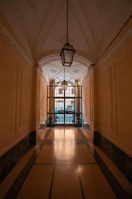 an empty hallway with a large window in a building at Vatican Charming RHome in Rome