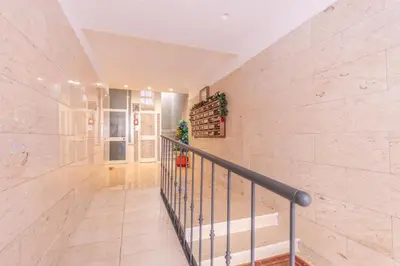 a hallway with a staircase in a building at Easy Host Apt Casa Numitore in Rome