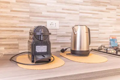 a toaster and a coffee maker on a counter at Easy Host Apt Casa Numitore in Rome