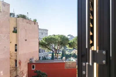 a view of a city from a window at Maison Colosseo in Rome