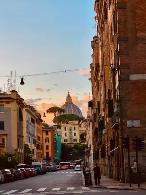 a city street with a view of a dome at B&B Rome Vatican Residence in Rome