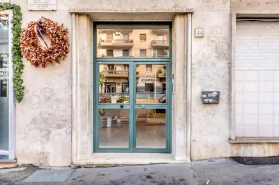 a door to a building with a wreath on it at Villa Up in Rome