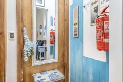 a room with a blue door and a window at Villa Up in Rome