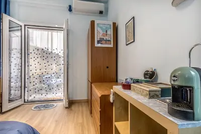 a room with a kitchen with a glass door at Villa Up in Rome