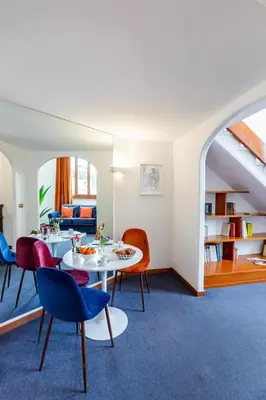 a living room with a table and chairs at Spanish Steps Luxury Apartment in Rome