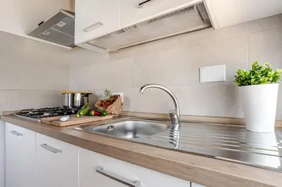 a kitchen with a sink and a stove at Casa Doria - ROMA in Rome