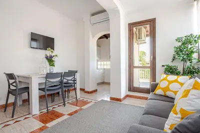 a living room with a couch and a table at Casa Doria - ROMA in Rome