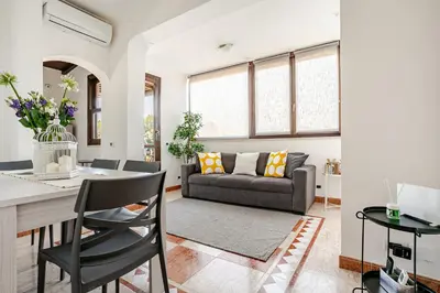 a table and chairs on the balcony of a house at Casa Doria - ROMA in Rome