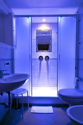 a bathroom with two sinks and a shower at Optimus B&B in Rome
