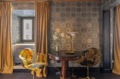 a dining room with a table and two chairs at Apppartamenti Vicolo degli Osti in Rome