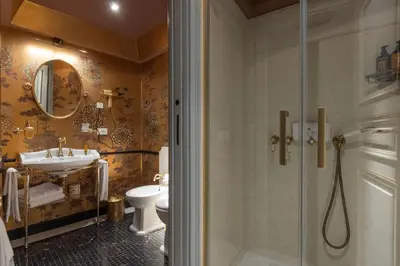 a bathroom with a shower and a sink and a toilet at Apppartamenti Vicolo degli Osti in Rome