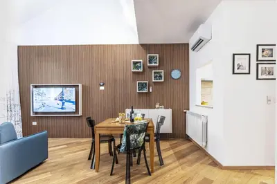 a dining room with a table and chairs at Italian Experience-Suite Trastevere in Rome