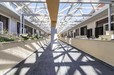 a hallway of a building with a glass ceiling at Italian Experience-Suite Trastevere in Rome