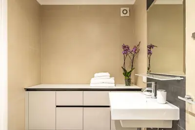 a bathroom with a sink and a mirror at Italian Experience-Suite Trastevere in Rome