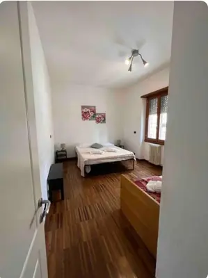 a bedroom with a bed and a ceiling fan at Maison del Forte Boccea 108 in Rome