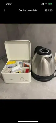a lunch box with a tea kettle on a counter at Trevi 88 in Rome