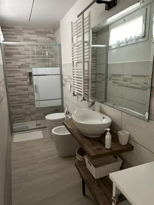 a bathroom with a sink and a toilet at Trevi 88 in Rome
