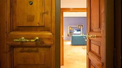 an open wooden door with a gold door knob at Marble House 7 in Rome