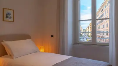 a bedroom with a bed and a window at Marble House 7 in Rome