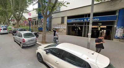 a white car parked on the side of a street at Rome Ostiense Apartment in Rome
