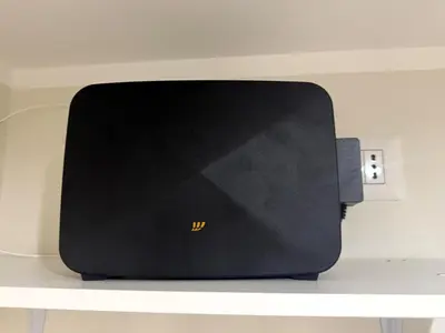 a black router sitting on top of a shelf at Rome Ostiense Apartment in Rome