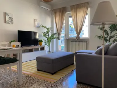 a living room with a couch and a table at FAIROME Apartment Albricci in Rome