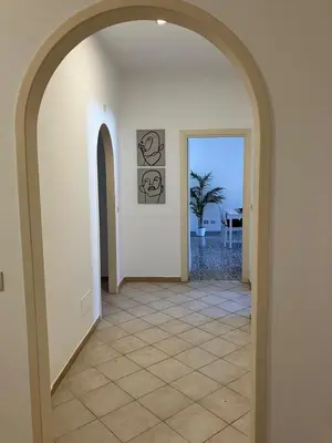 a hallway with an archway in a house at FAIROME Apartment Albricci in Rome