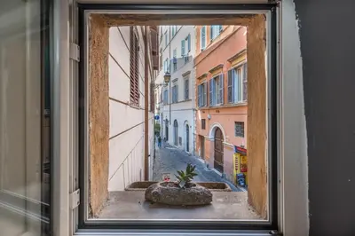 a bedroom with a bed and a table in a room at SorinaHome Campo de Fiori Loft in Rome