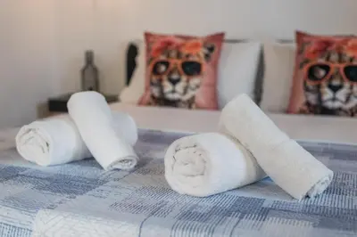 a pile of toilet paper on a bed with a dog at SorinaHome Campo de Fiori Loft in Rome