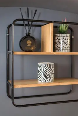 a shelf with two plants and a pot on it at SorinaHome Campo de Fiori Loft in Rome