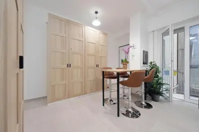a dining room with a table and some chairs at 4BNB - The Dome TwentyFive in Rome
