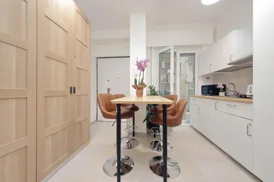 a kitchen with a table and chairs in a kitchen at 4BNB - The Dome TwentyFive in Rome