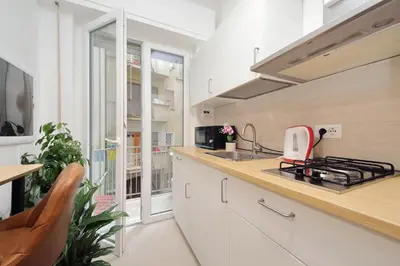 a kitchen with a sink and a stove top oven at 4BNB - The Dome TwentyFive in Rome