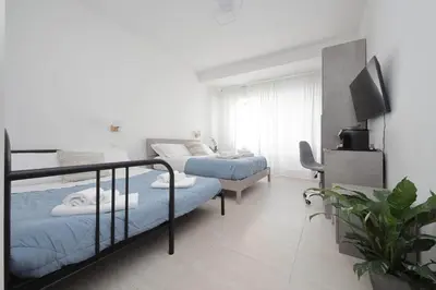 a bedroom with two bunk beds and a tv at 4BNB - The Dome TwentyFive in Rome