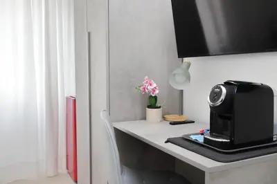 a kitchen with a counter top with a microwave and a microwave at 4BNB - The Dome TwentyFive in Rome