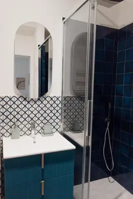 a bathroom with a sink and a mirror at Zoe Vatican rooms in Rome
