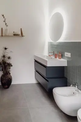a bathroom with a white sink and a toilet at Zoe Vatican rooms in Rome