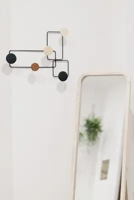 a mirror and a light on a white wall at Zoe Vatican rooms in Rome