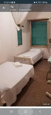 a bathroom with a toilet and a sink at Kotel lorenzo il magnifico in Rome