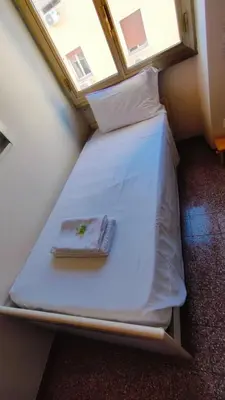 a bathroom with a toilet and a sink at Kotel lorenzo il magnifico in Rome