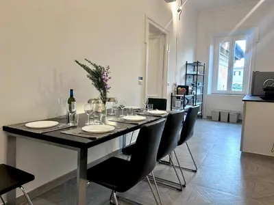 a bedroom with a bed and a large window at Vicolo Doria 2 in Rome