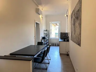 a bedroom with a large bed in a room at Vicolo Doria 2 in Rome