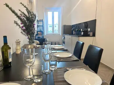 a kitchen with a sink and a window at Vicolo Doria 2 in Rome